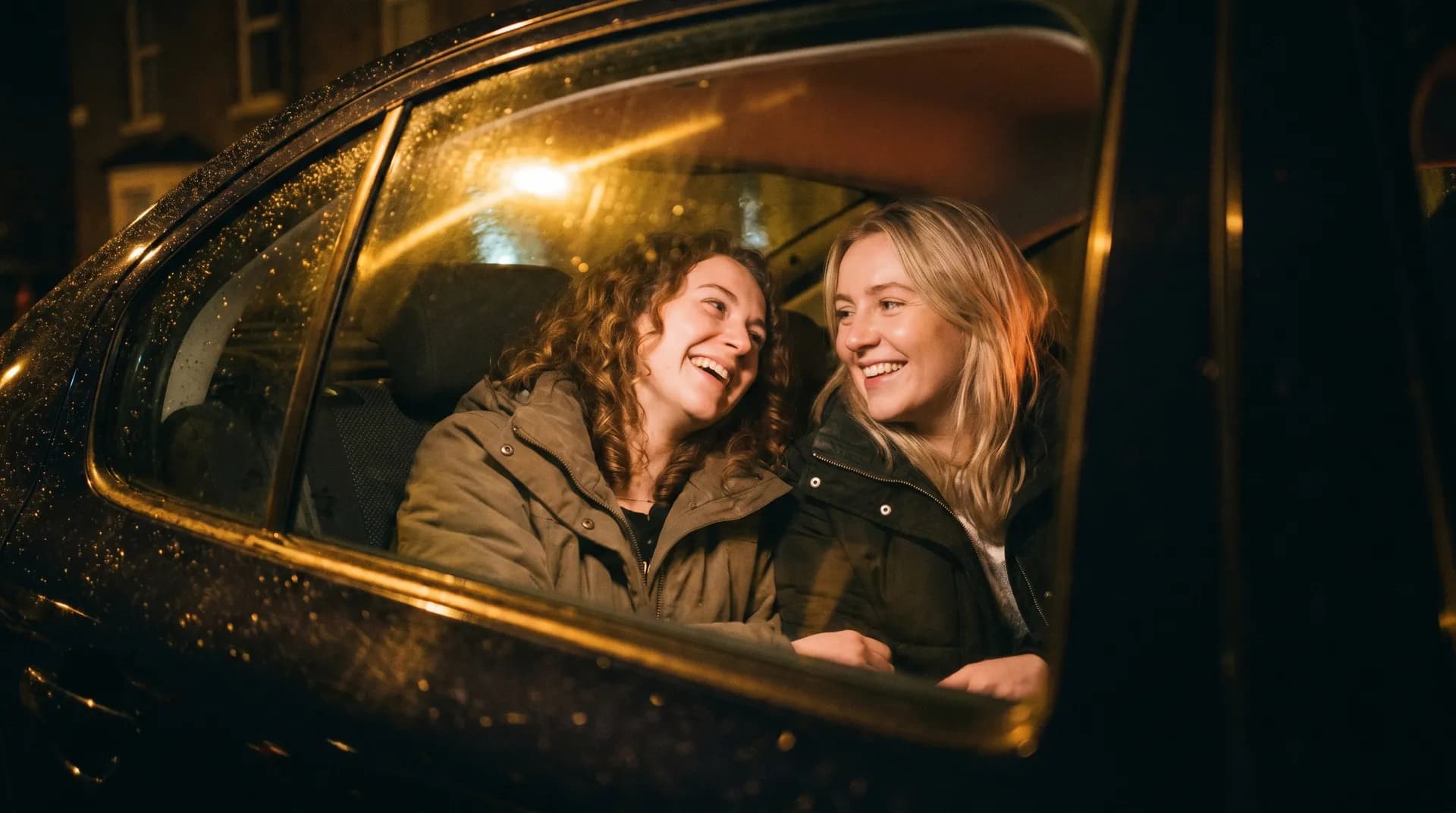 Passengers in the back of a Wednesfield Cars taxi in Wolverhampton